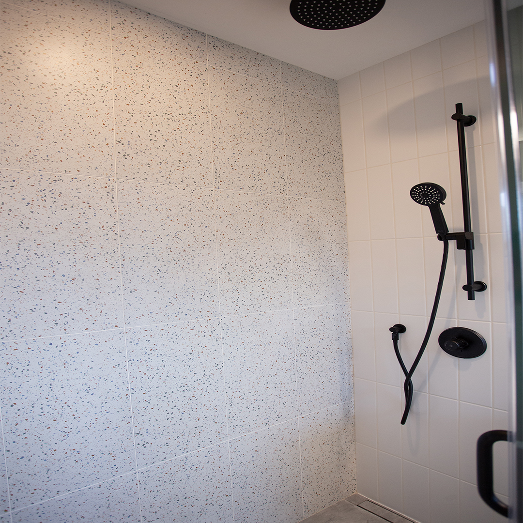 Interior of modern shower with black fixtures