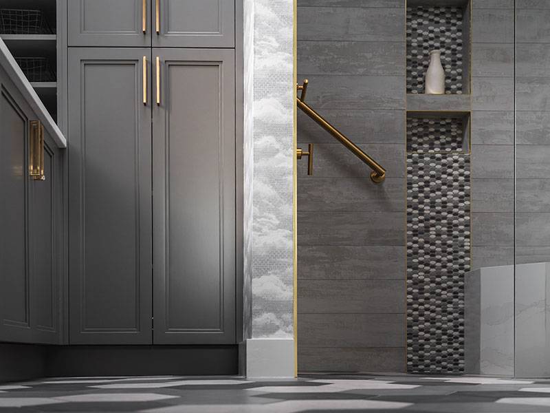 Modern bathroom with dark grey cabinetry and gold hardware