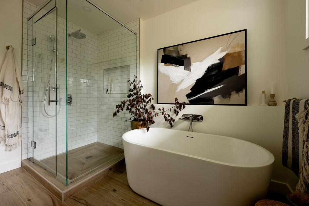 Modern bathroom with standalone bathtub and glass shower