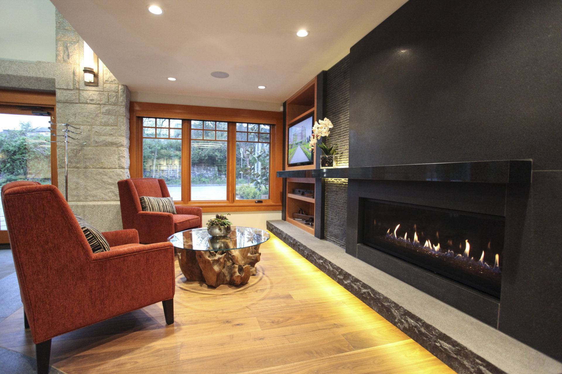 Lobby seating with large windows and long gas fireplace