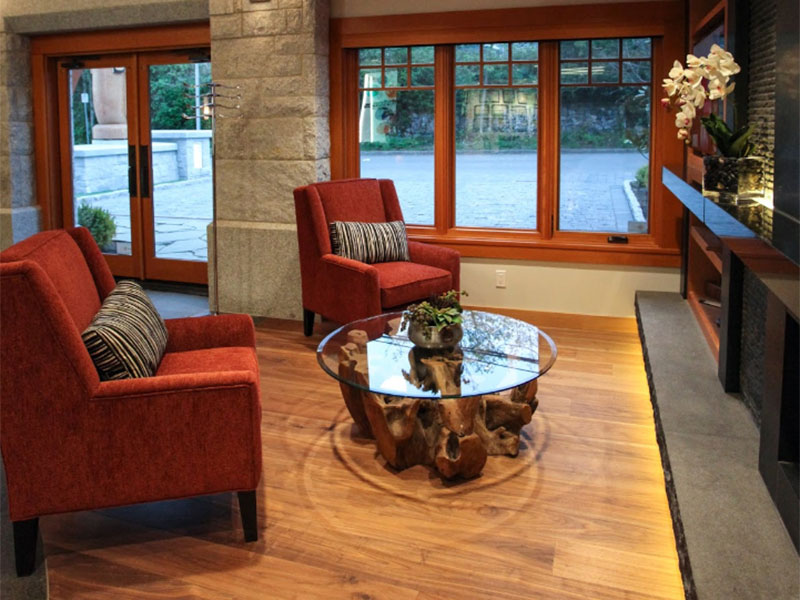 Seating with coffee table in lobby with large windows