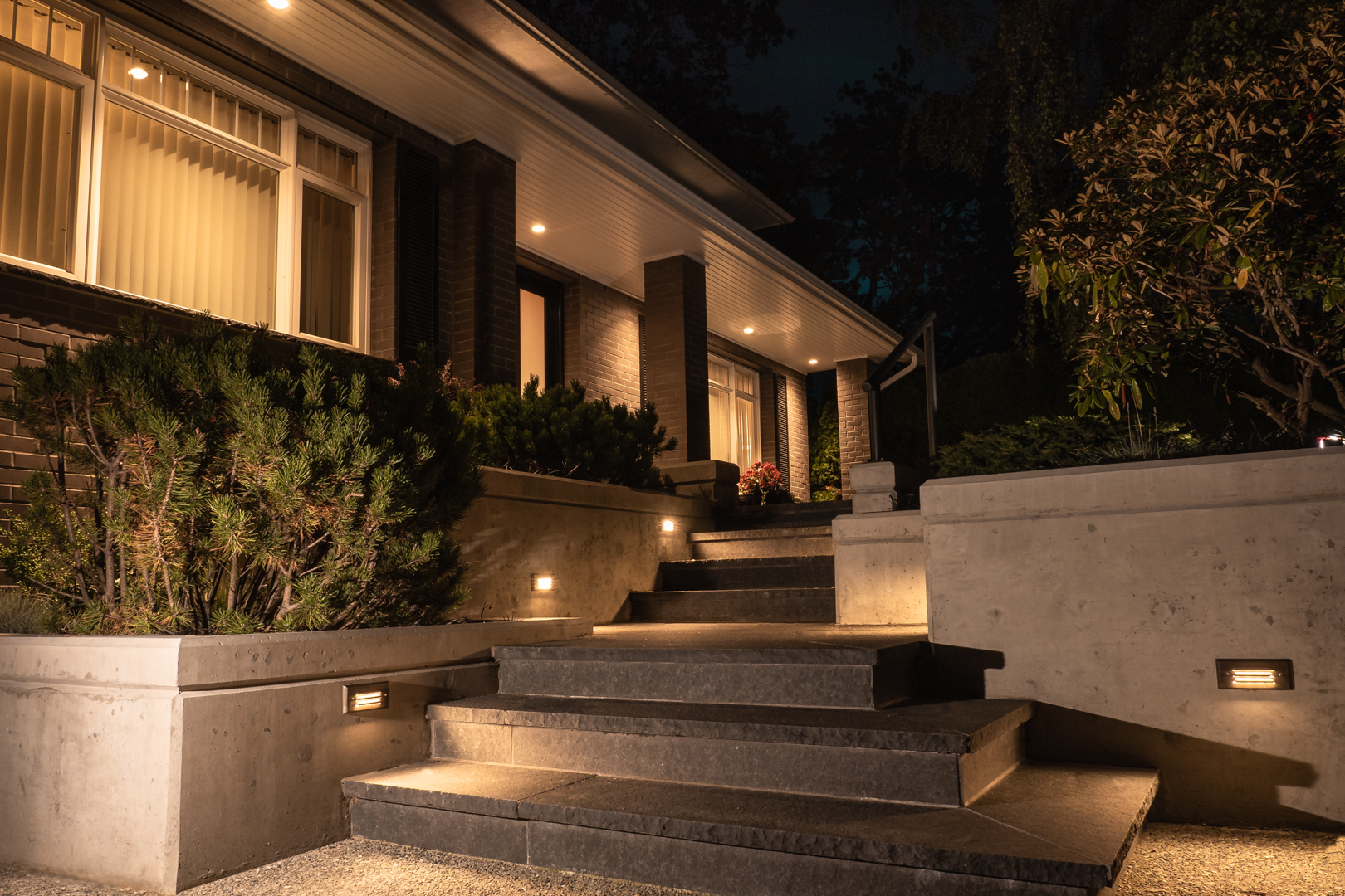 Stone steps leading up to house at night