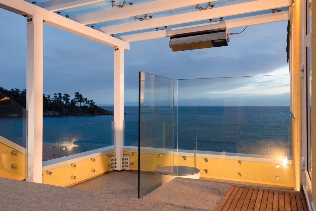 Ocean-side patio with glass walls