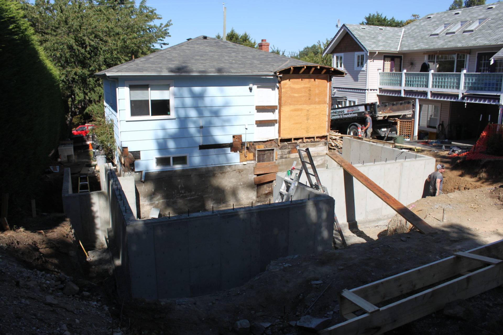 Construction around home with concrete retaining walls